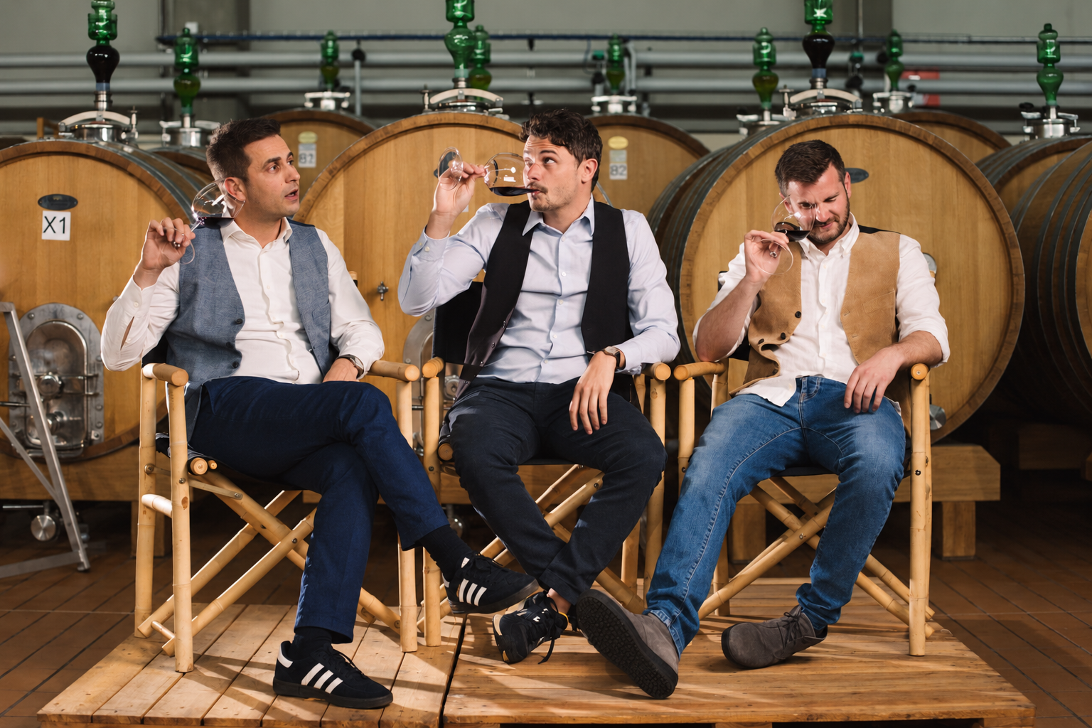 The three Inama brothers tasting wine in the estate cellar